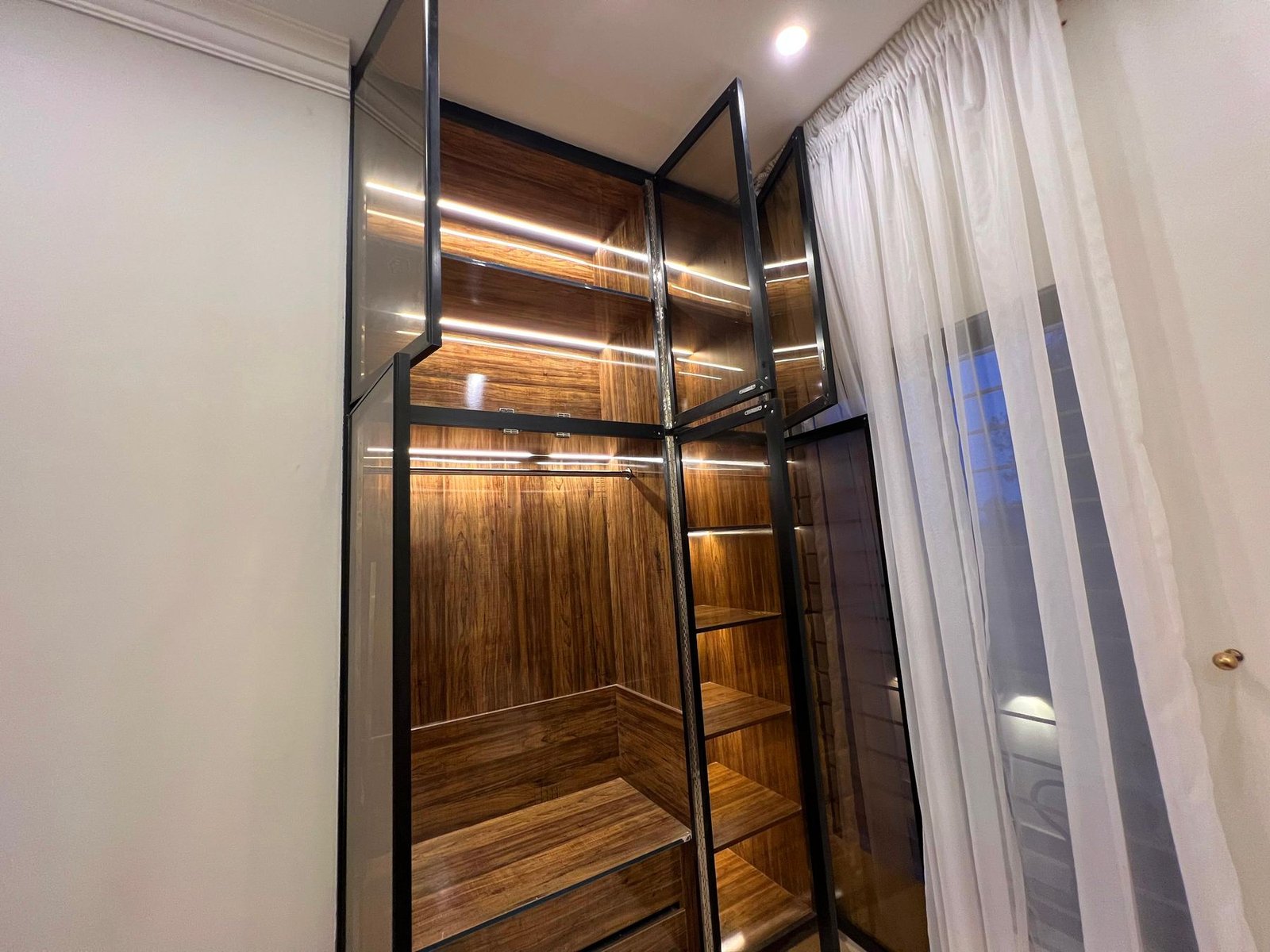 Walk-in wardrobe in walnut finish